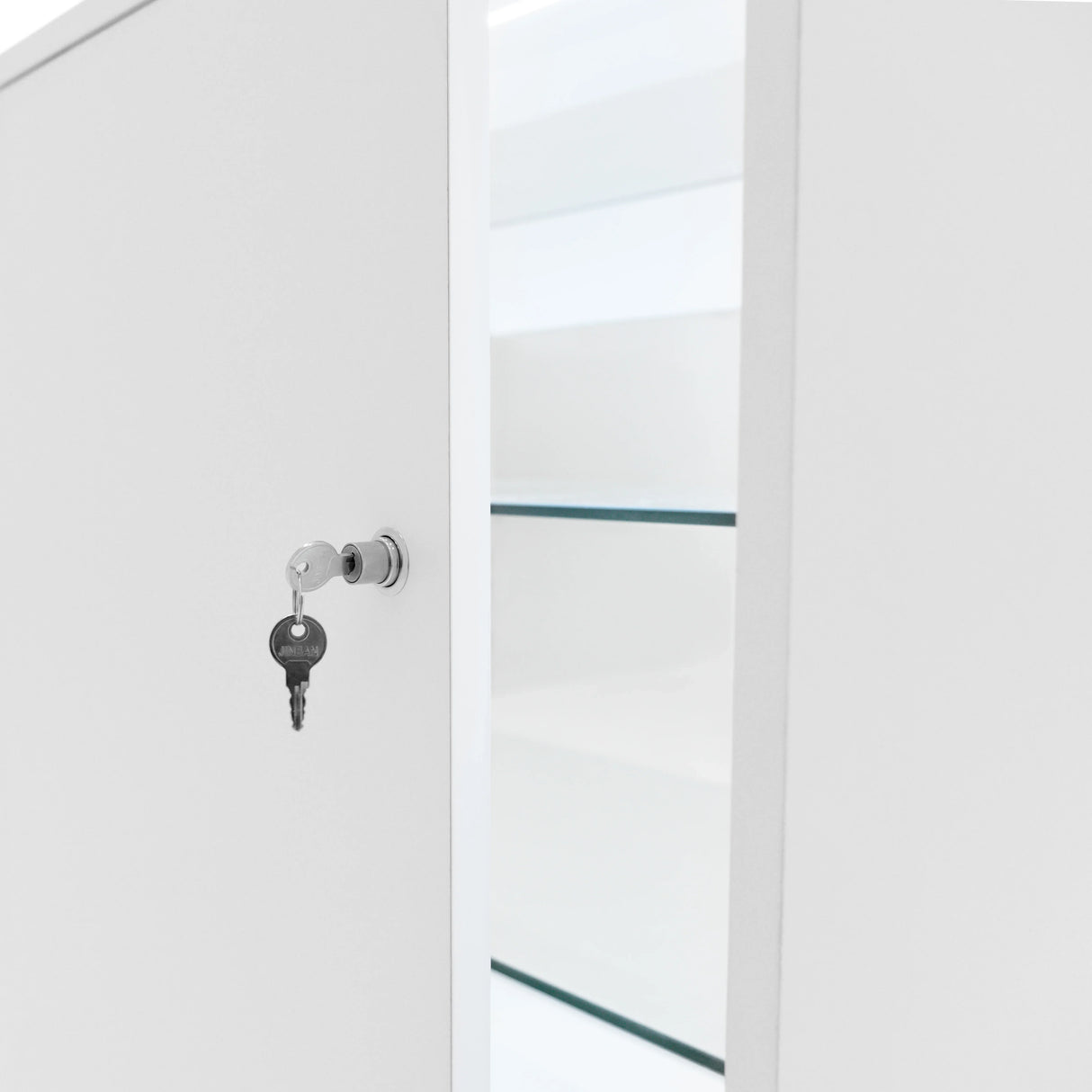White LED retail shop counter K1500 with a key in the lock, showcasing sleek design and glass shelves inside