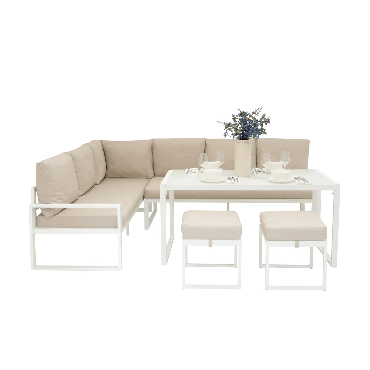 Stylish white aluminium corner sofa set with beige cushions, matching dining table, and decorative vase, perfect for outdoor spaces