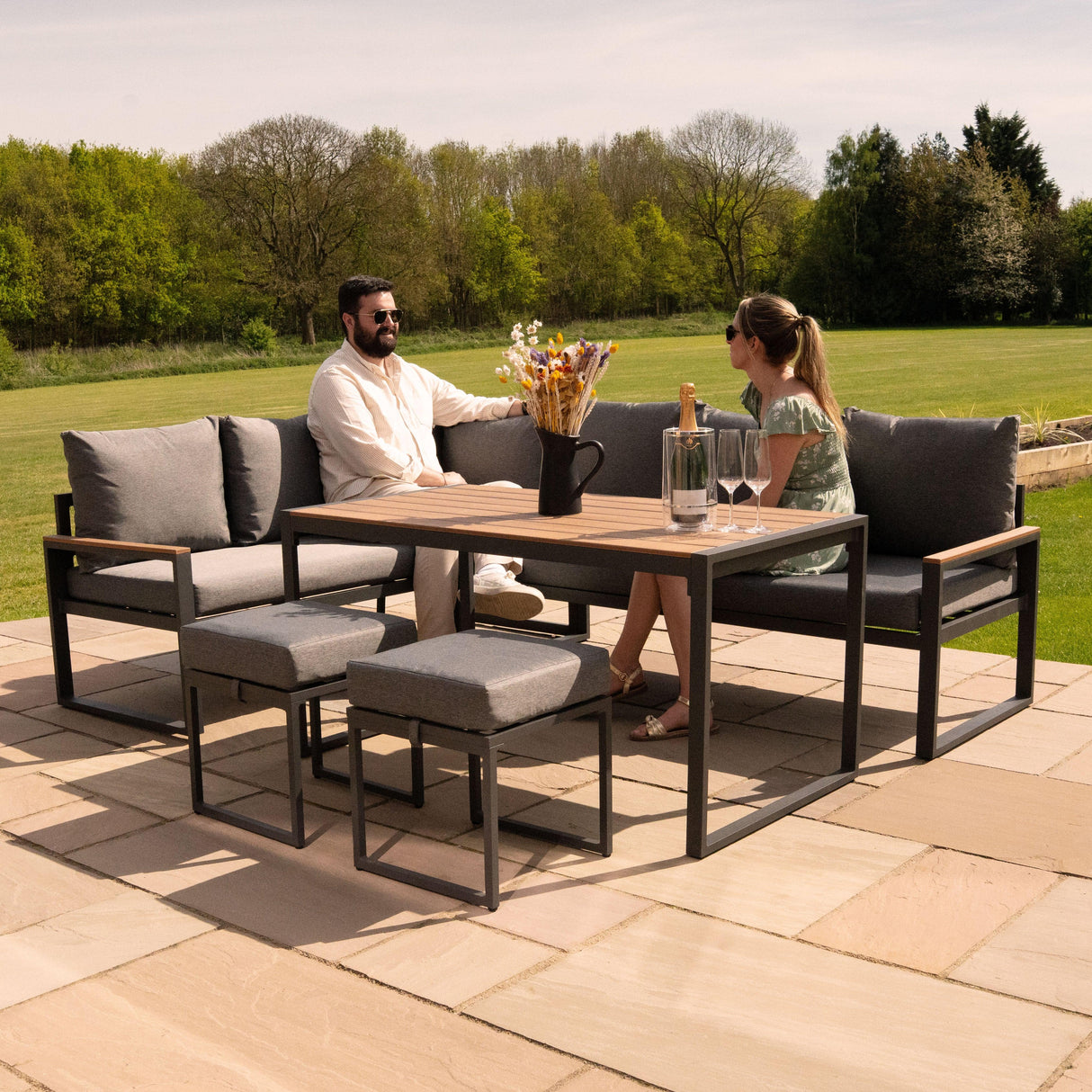 Aluminium corner sofa set with wood effect table, featuring grey cushions, stylish design, perfect for outdoor lounging and entertaining