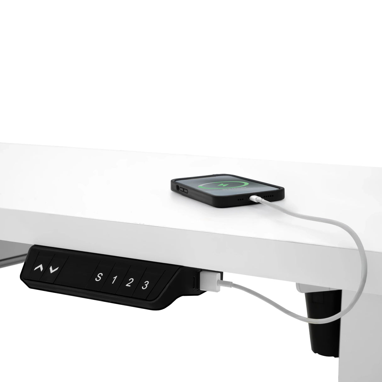 Electric standing desk with a sleek white finish, featuring a control panel and a smartphone charging on top, highlighting modern functionality