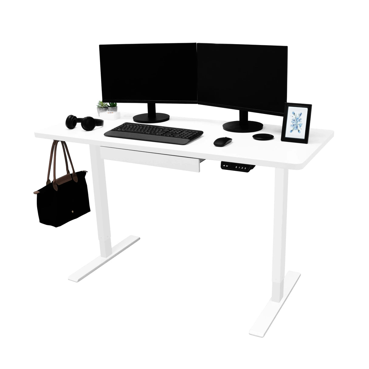 Electric standing desk with a sleek white finish, dual monitors, keyboard, headphones, and a drawer for storage, ideal for home offices