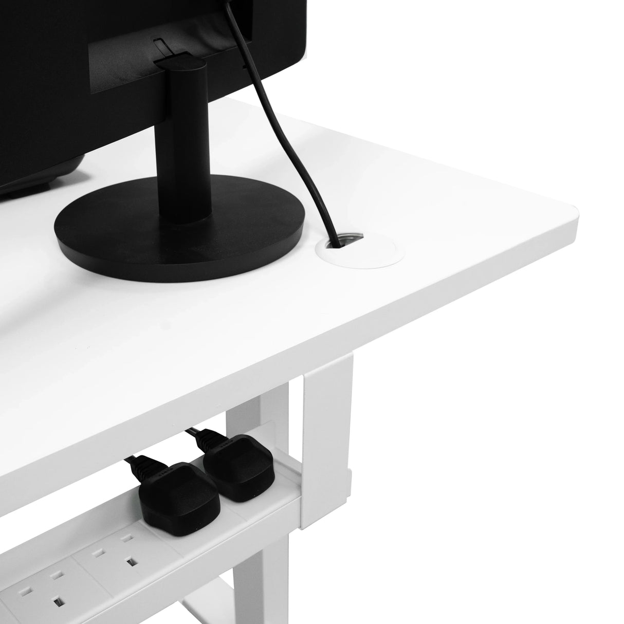 Electric standing desk with a sleek white surface, black cable management, and a drawer for storage, ideal for home offices