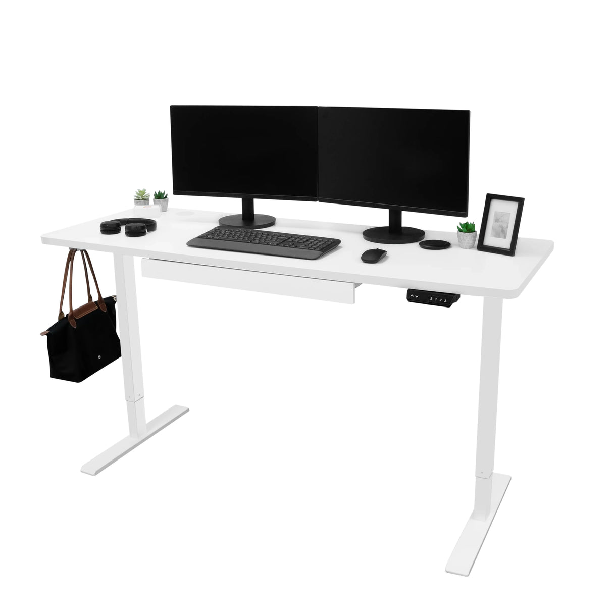 Electric standing desk with a sleek white finish, dual monitors, keyboard, drawer, and potted plants, perfect for a modern workspace