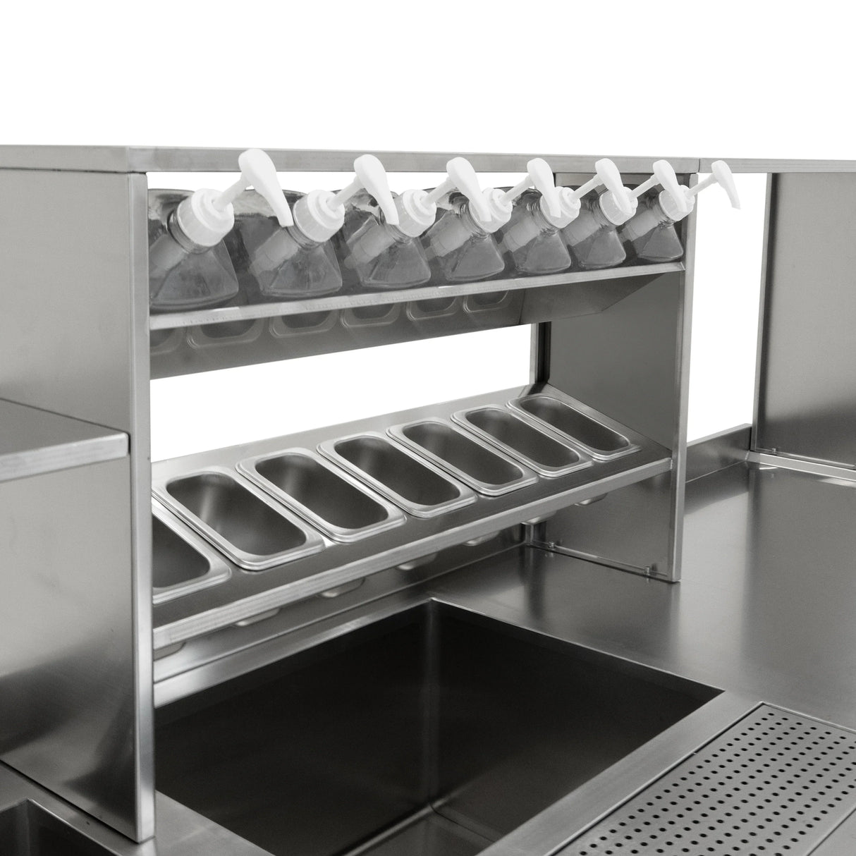 Stainless steel bubble tea workstation featuring multiple pump dispensers, ingredient trays, and a spacious sink for efficient preparation