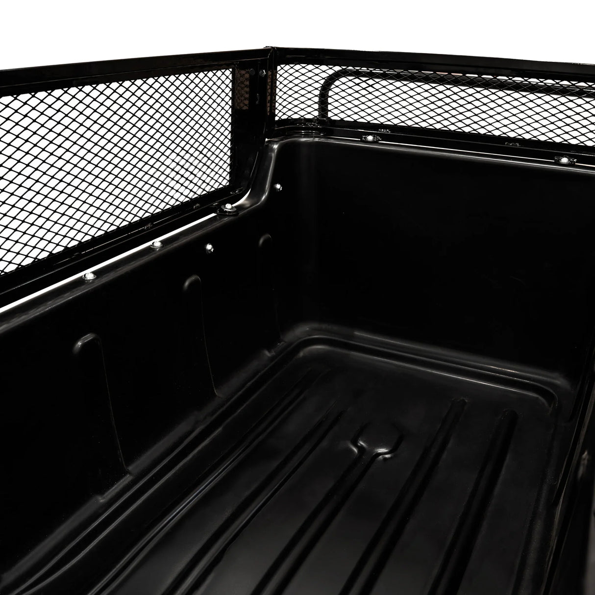 Black metal interior of a 4-wheel tipping trailer, featuring a smooth, durable surface and a protective mesh back for added security