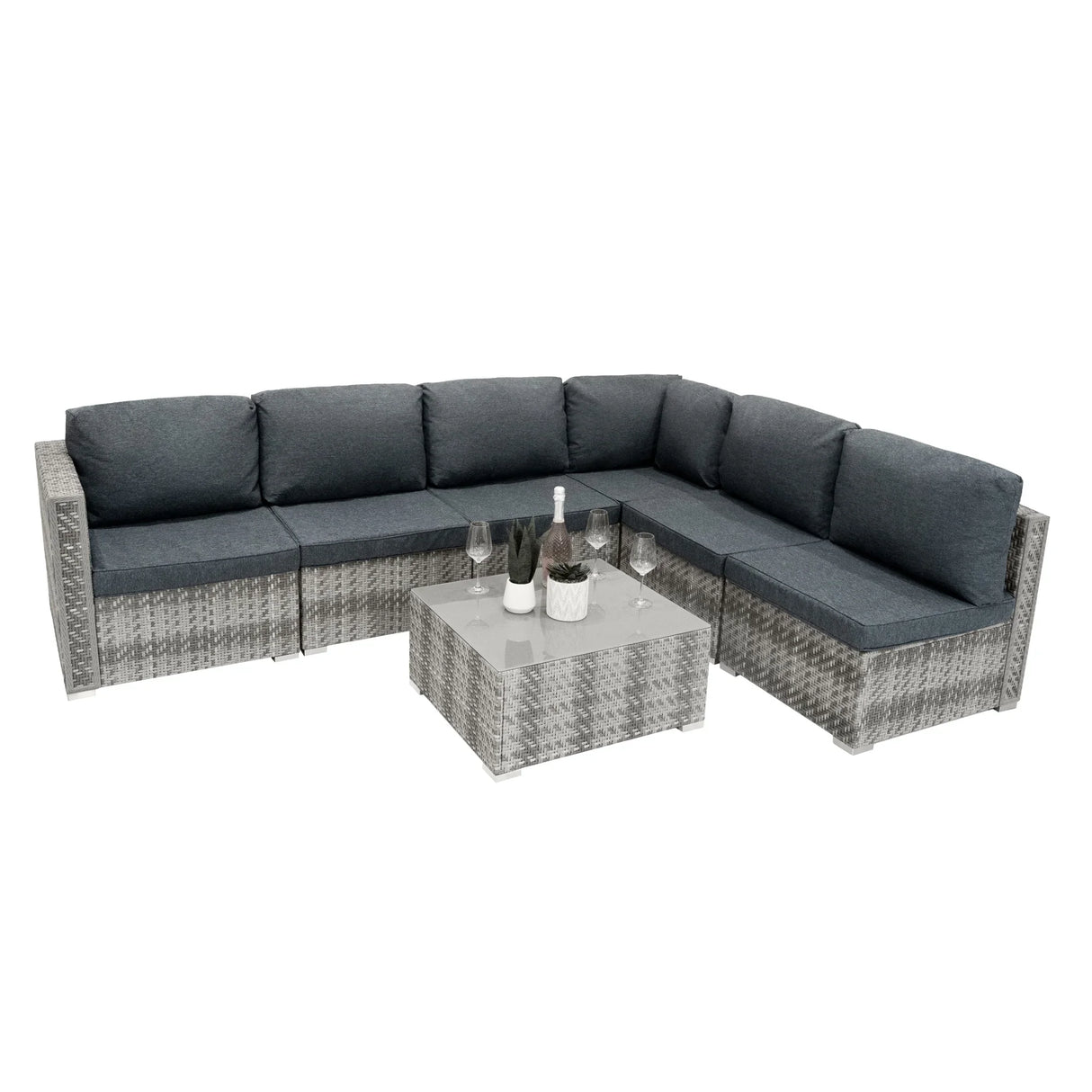 Grey rattan modular 7-piece furniture set featuring plush cushions, a sleek glass-top coffee table, and a contemporary design