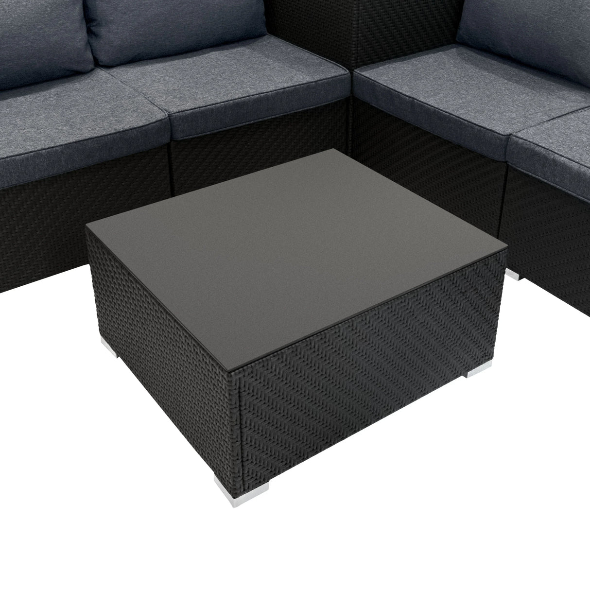 Rattan modular furniture set in black featuring a sleek square coffee table with a textured surface and gray cushioned seating