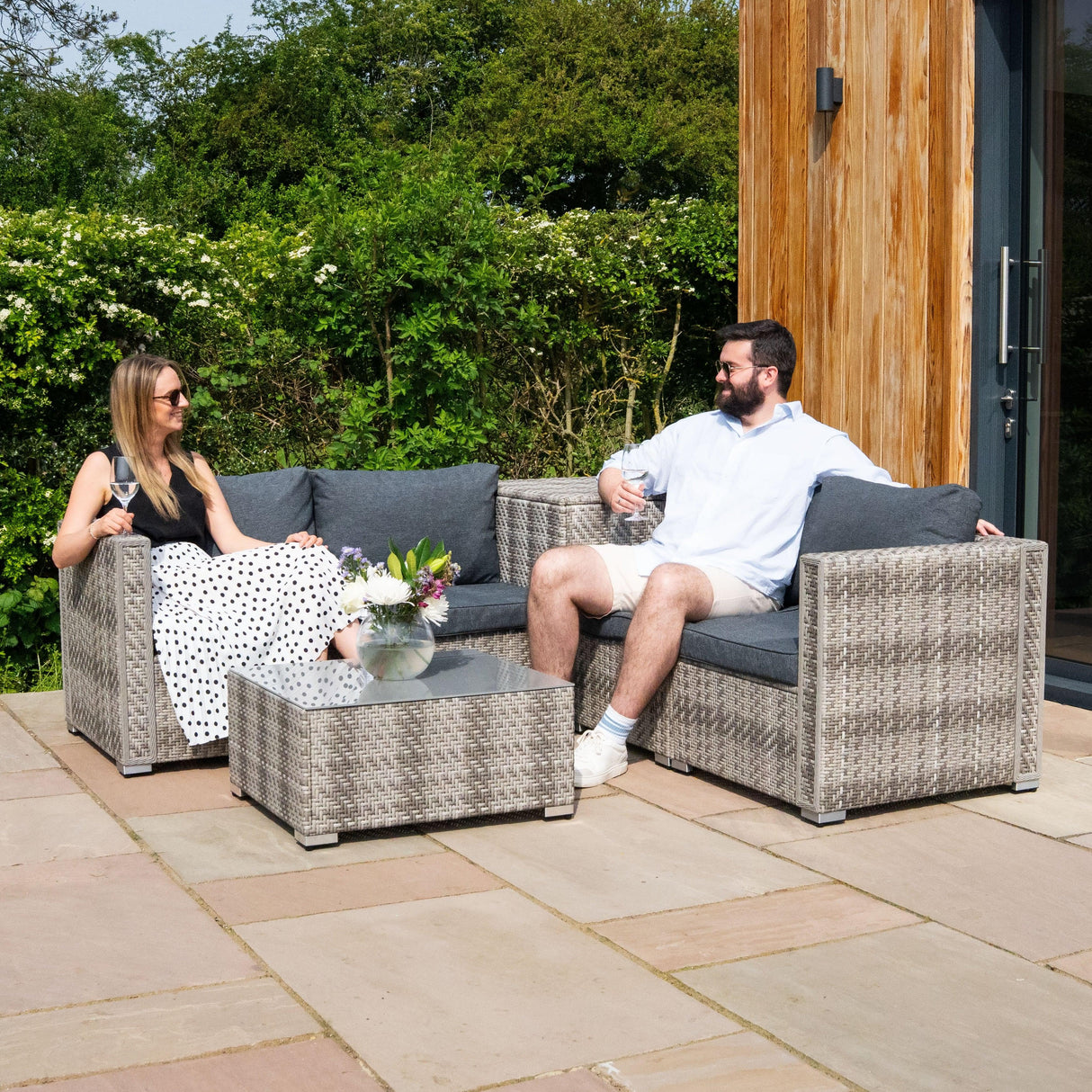 Grey rattan modular 6 piece furniture set featuring comfortable cushions, a sleek coffee table, and a stylish outdoor setting