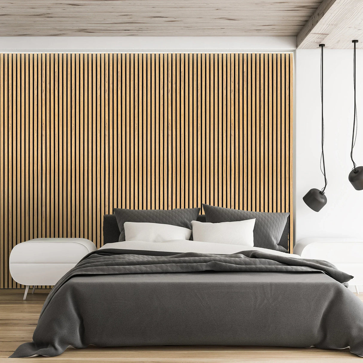 Acoustic slat wall panels in oak create a warm, textured backdrop in a modern bedroom with a gray bedspread and sleek nightstands