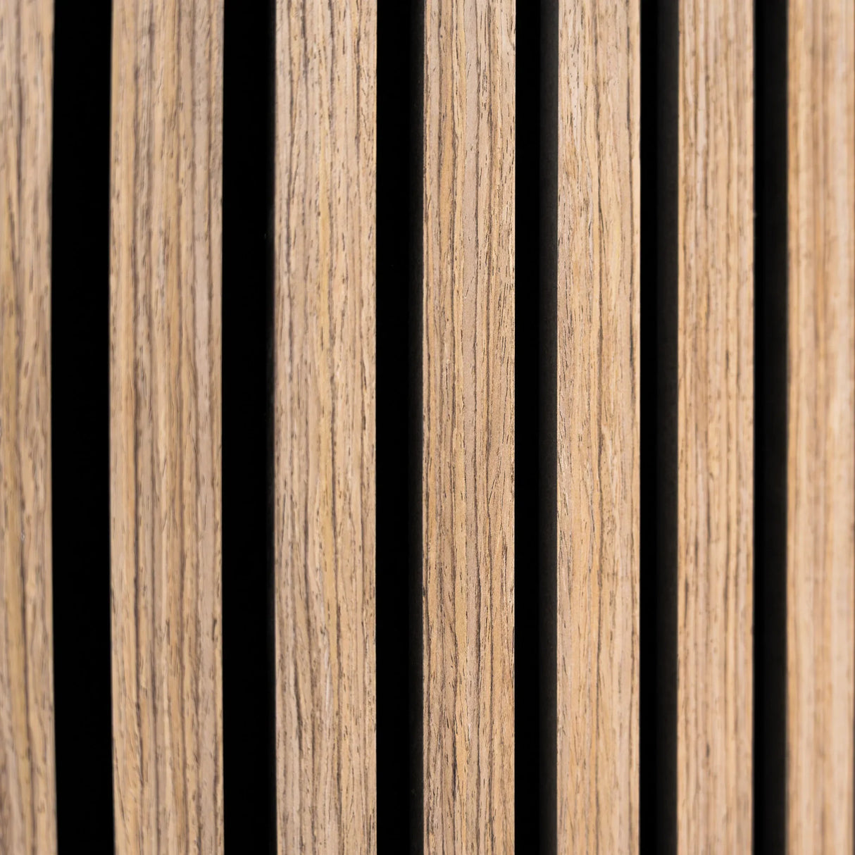 Light walnut acoustic slat wall panels featuring a textured finish and vertical slats, ideal for sound absorption and aesthetic appeal
