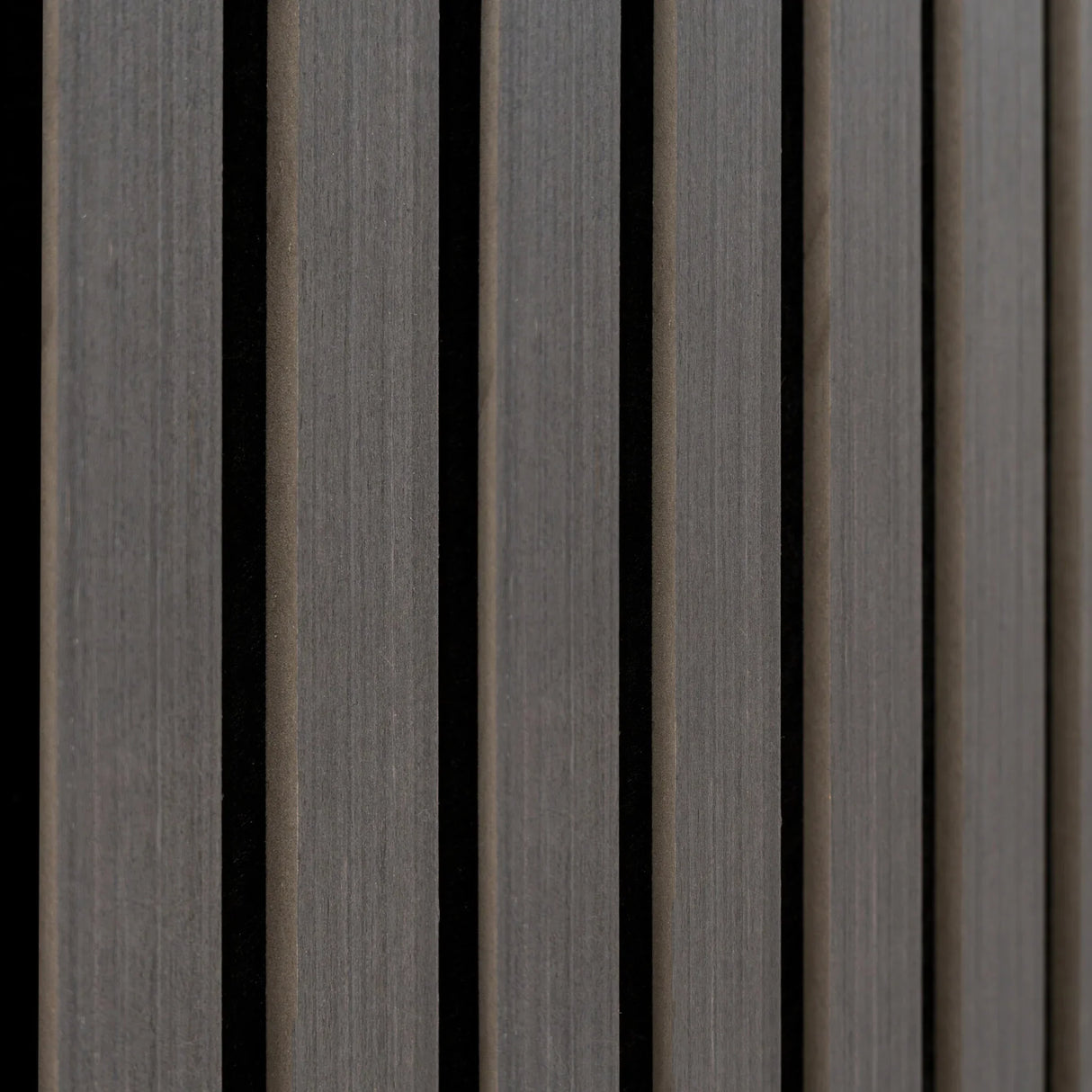 Acoustic slat wall panels in anthracite grey, featuring a textured finish and vertical slats for sound absorption and modern decor