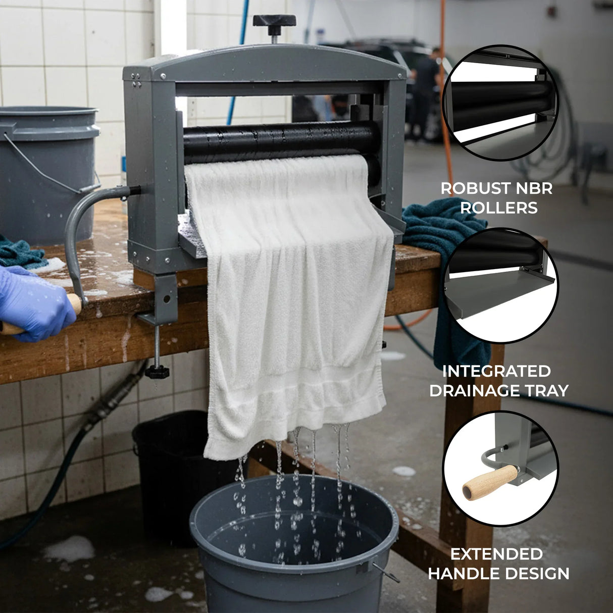 Manual hand wringer with robust NBR rollers, integrated drainage tray, and extended handle design, efficiently removing water from fabrics