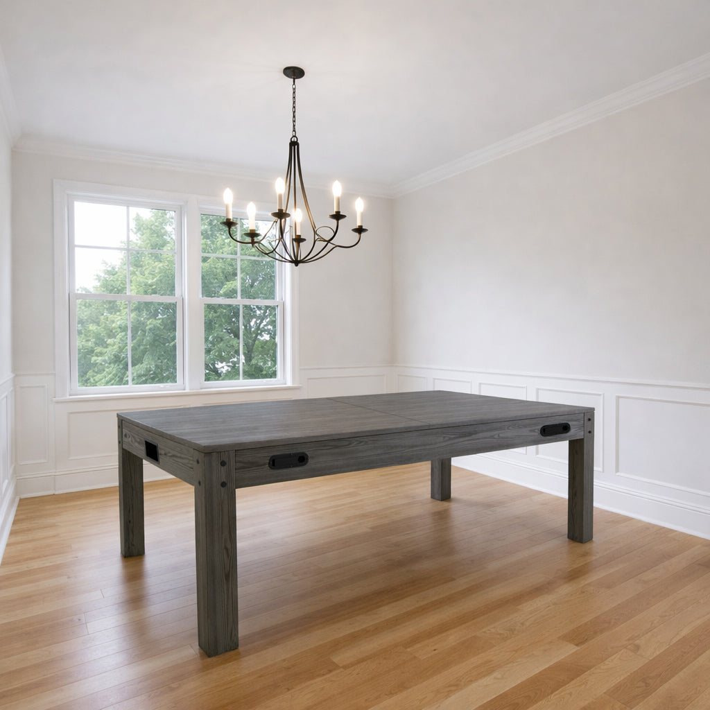 7-In-1 games table in grey finish, featuring a sturdy rectangular design, set in a bright room with natural light and elegant chandelier