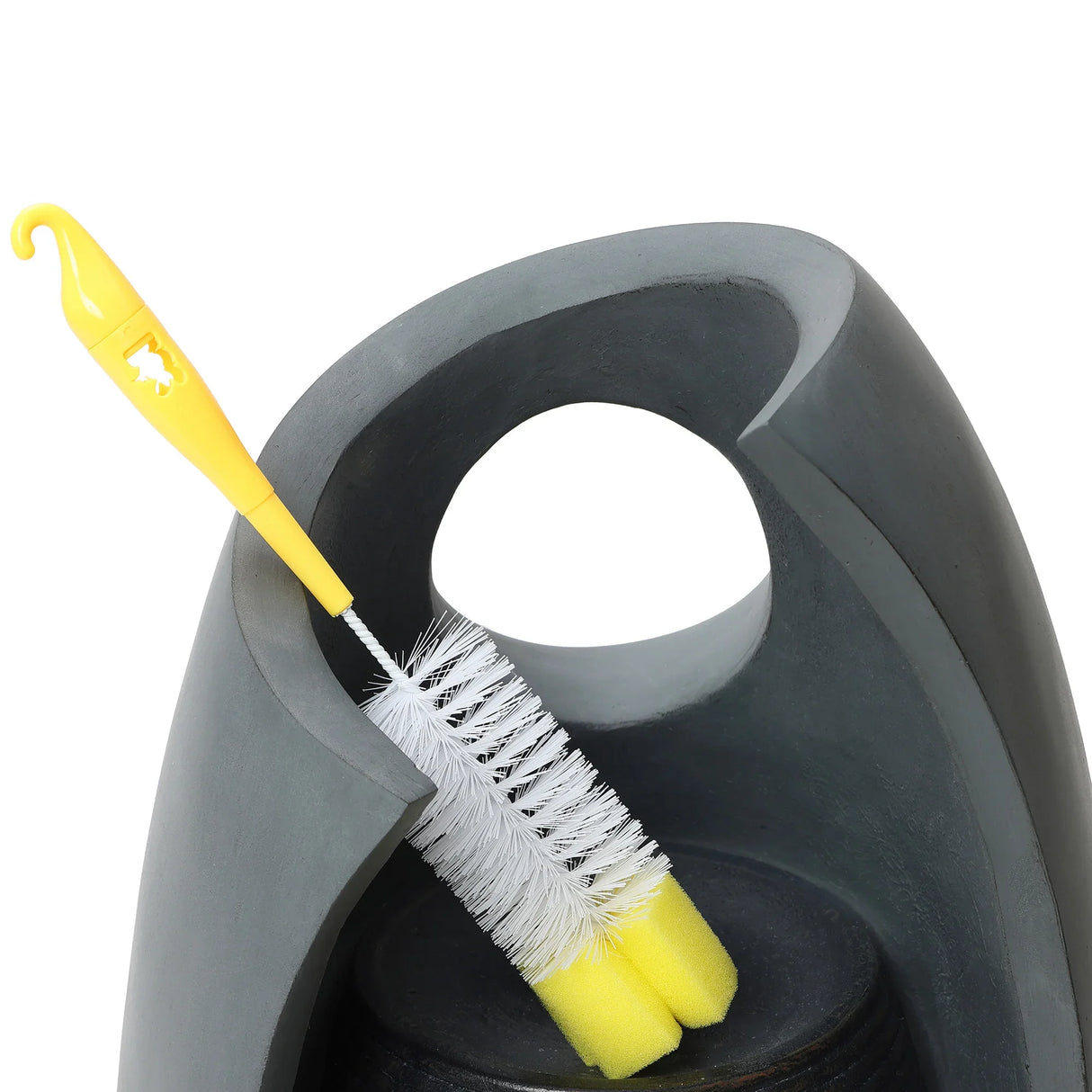 Sleek gray electric water feature with a curved design, featuring a yellow cleaning brush resting against its side