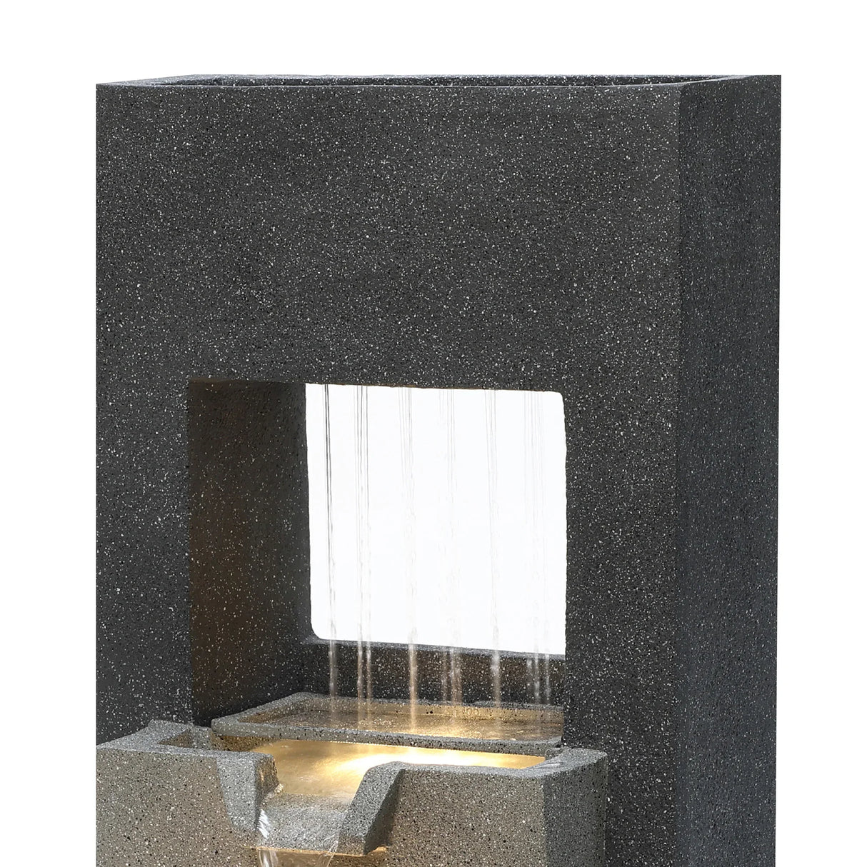Sleek black stone electric water feature with cascading water, illuminated from below, creating a tranquil ambiance