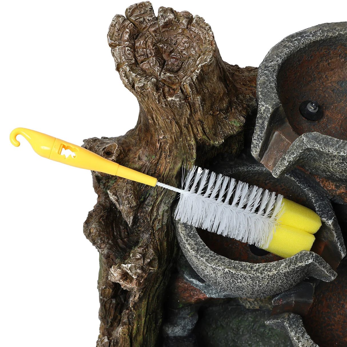 Rustic brook electric water feature with a textured tree bark design, featuring a yellow cleaning brush for maintenance