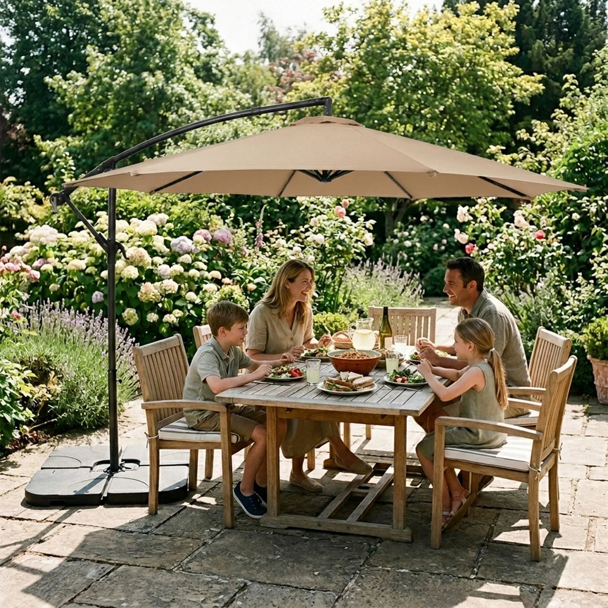 Beige cantilever parasol providing shade over a wooden dining table with a family enjoying a meal in a garden setting