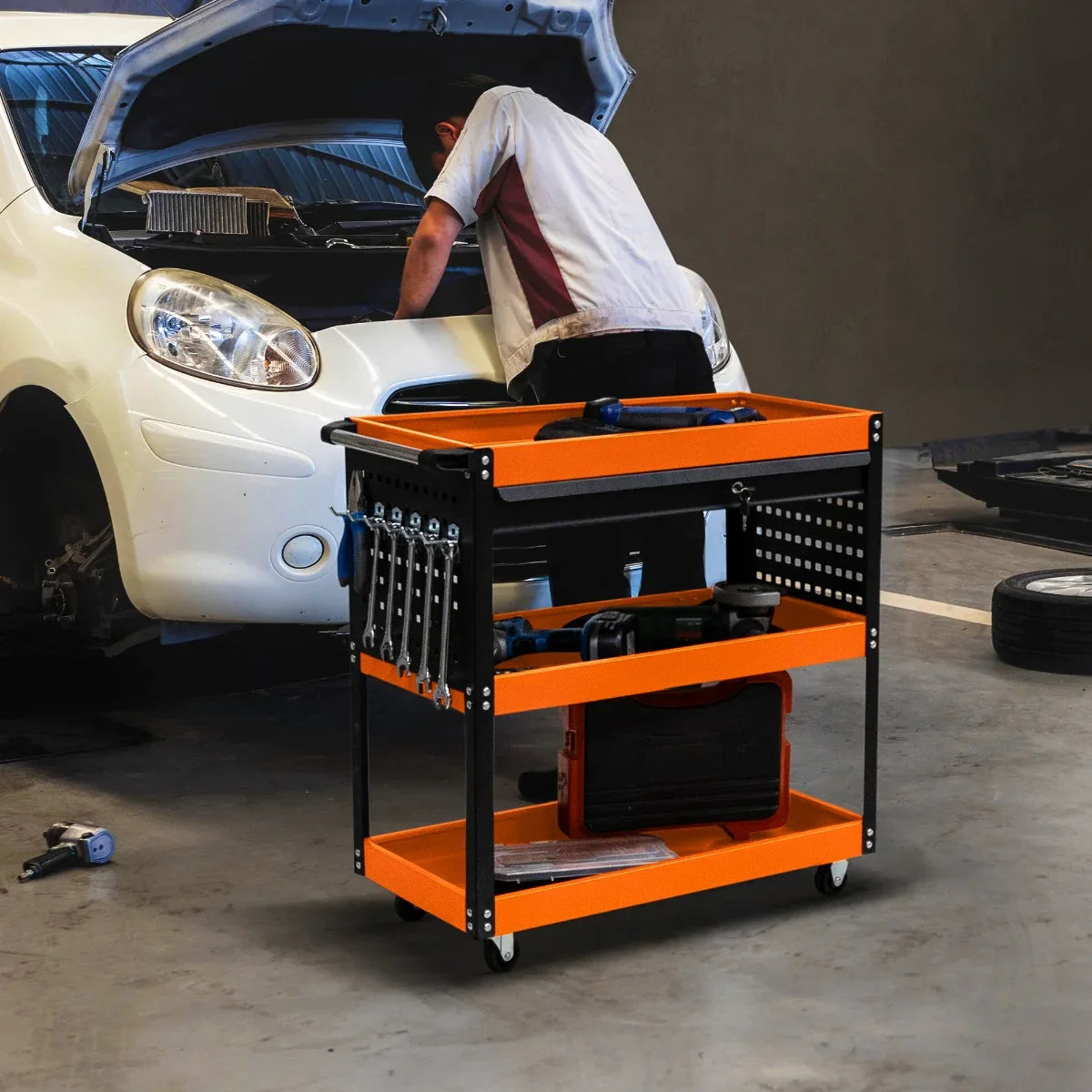 T-Mech Tool Storage Trolley with orange shelves and black frame, featuring tools and a mechanic working on a white car engine