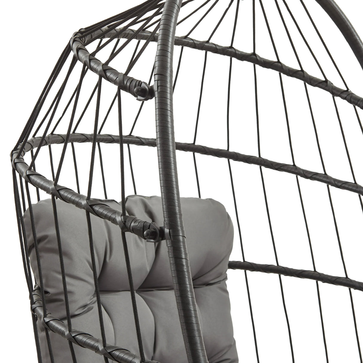 Black rattan hanging egg chair featuring a cushioned gray seat, woven texture, and an open, airy design perfect for relaxation