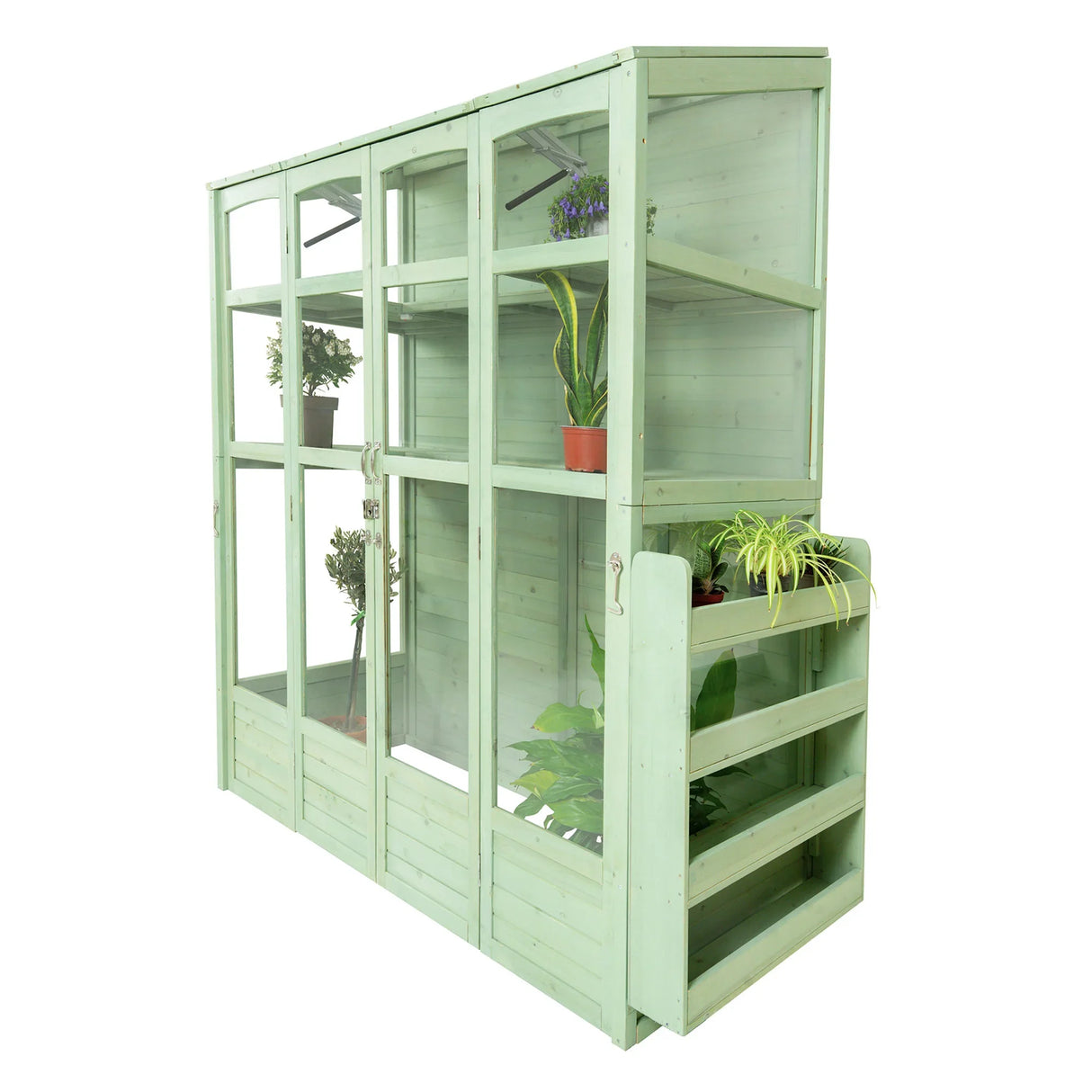 Victorian-style greenhouse in soft green wood, featuring multiple shelves, glass panels, and potted plants for indoor gardening