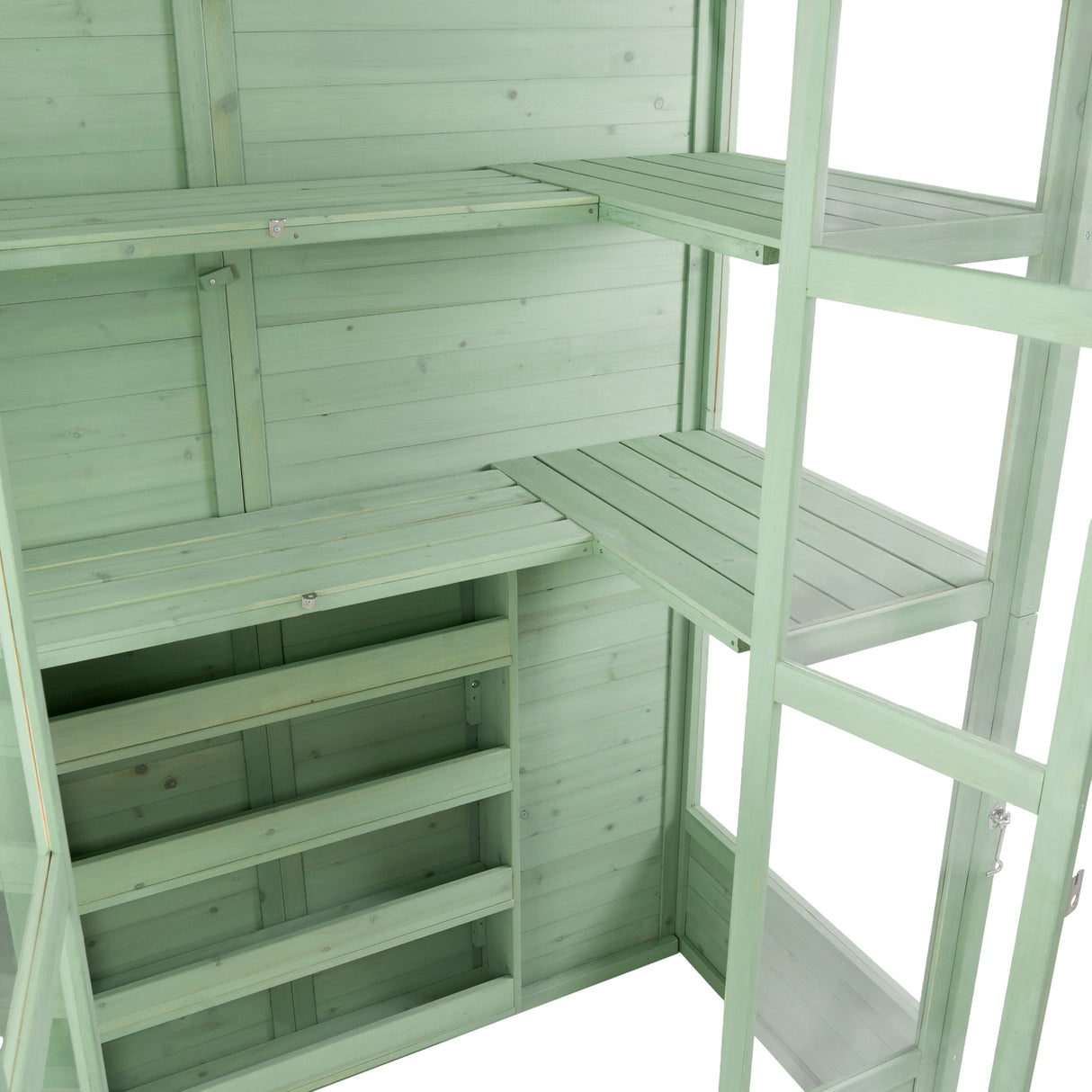 Victorian greenhouse in soft green wood, featuring multiple shelves and a spacious interior for plants and gardening supplies