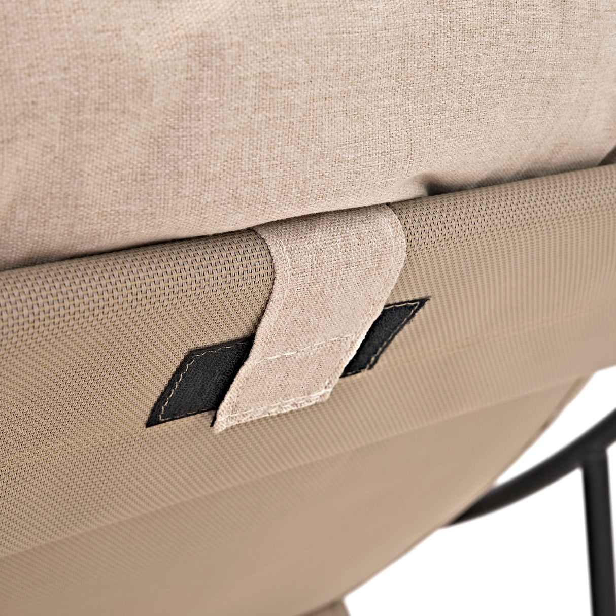 Close-up of a grey and cream bistro chair's textured fabric and sturdy black metal frame, showcasing quality craftsmanship and design
