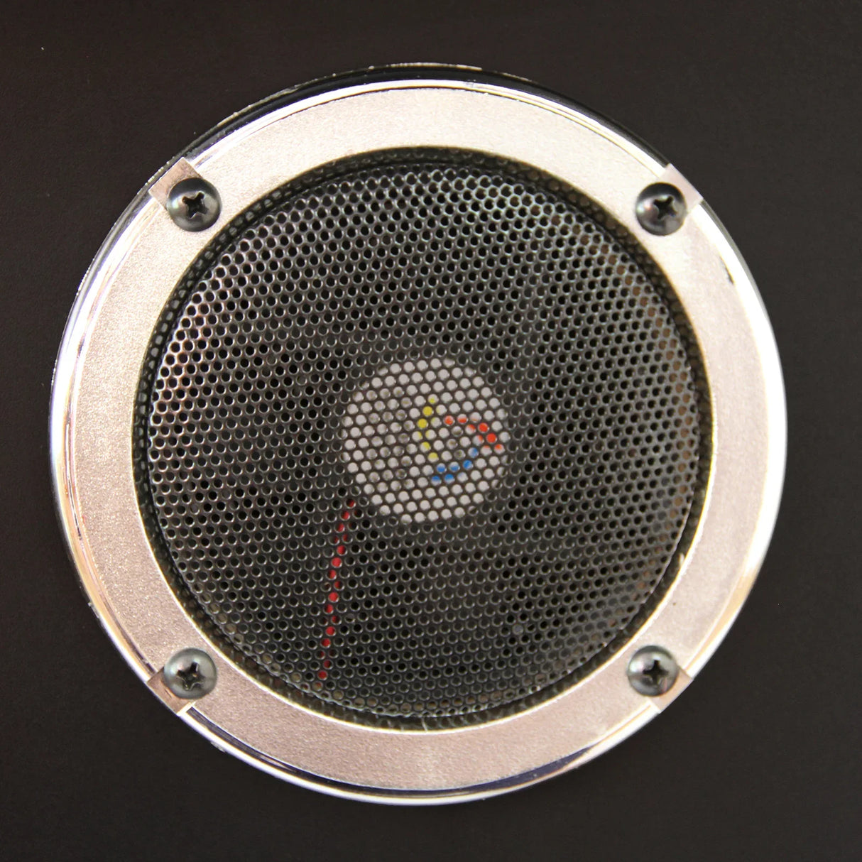 Close-up of the speaker grille on a Retro Cocktail Table Arcade Games Machine, featuring a metallic finish and mesh design for sound clarity