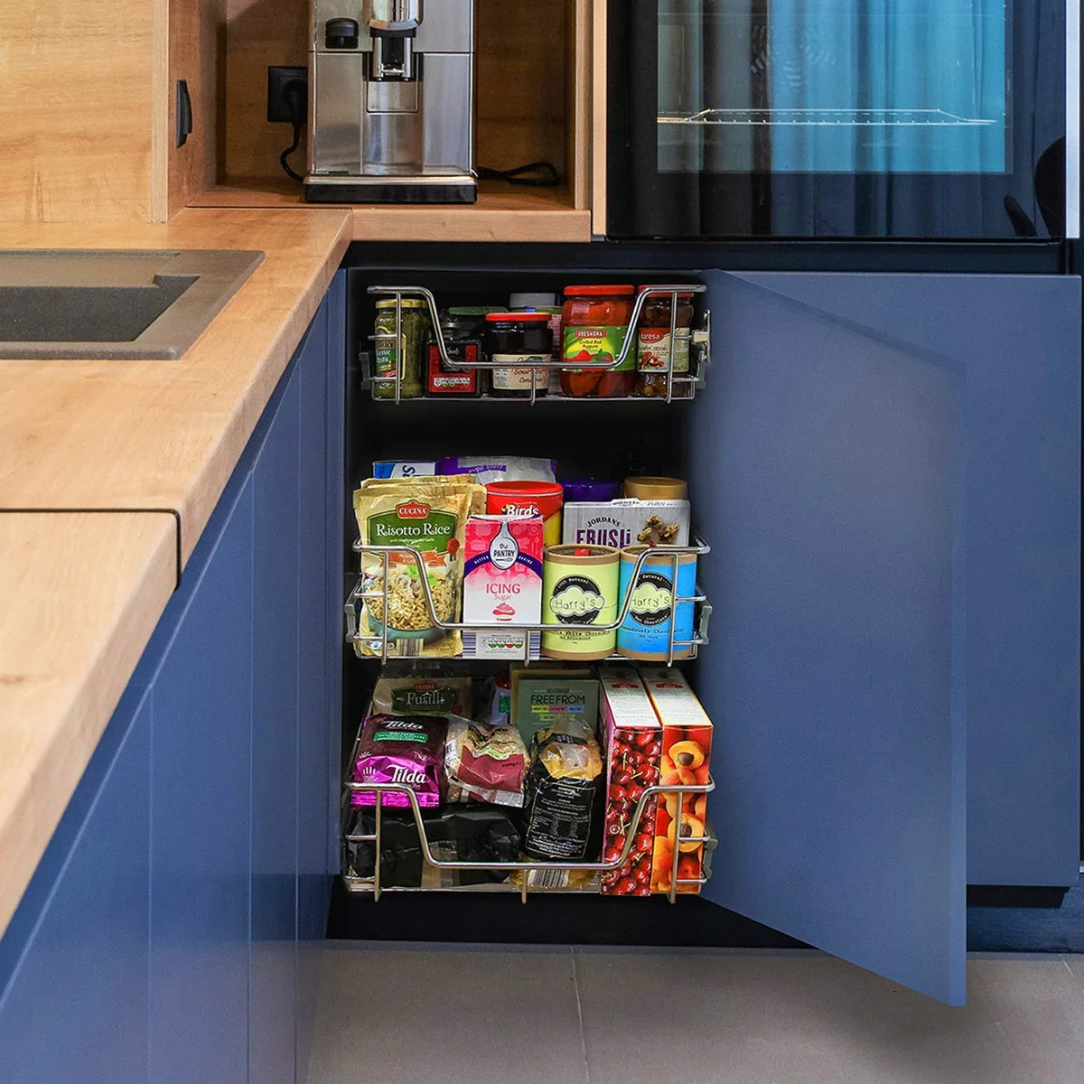 Pull-out storage baskets in a 500mm wide cabinet, featuring metal frames and organized compartments for easy access to pantry items