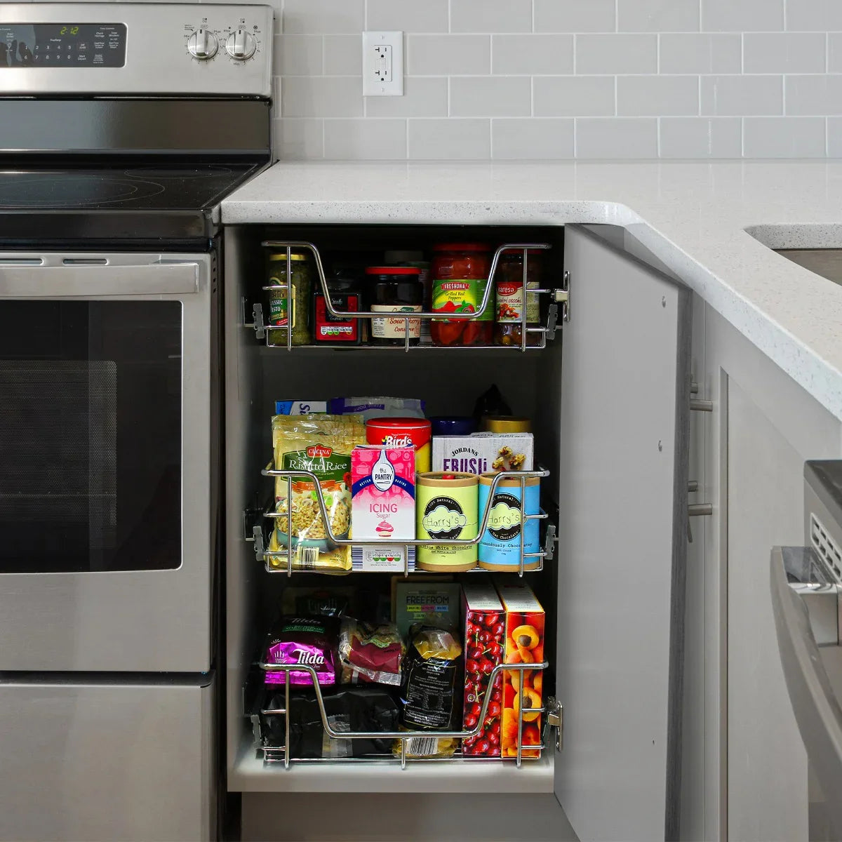 Pull-out storage baskets in a 500mm wide cabinet, showcasing organized jars and cans with a sleek metal frame and smooth gliding mechanism