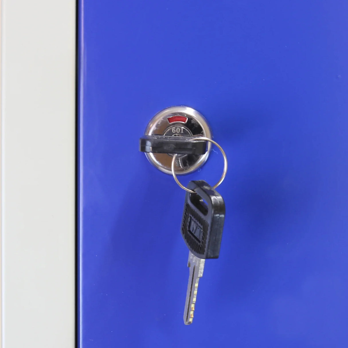 Blue metal storage locker with six doors, featuring a keyhole and key, showcasing a sleek, modern design and durable finish