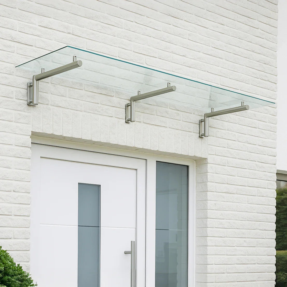 Stylish glass door canopy with stainless steel brackets, measuring 180cm wide by 80cm deep, enhancing entryway aesthetics