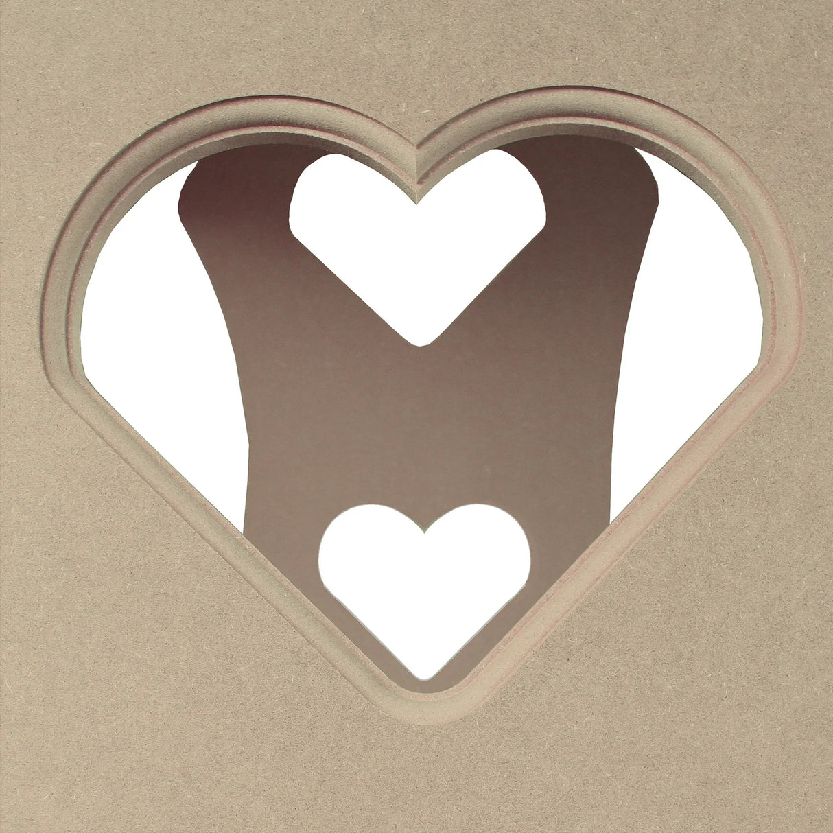 Heart-shaped cutout design on a beige backdrop, showcasing a playful and romantic detail ideal for wedding decor or events