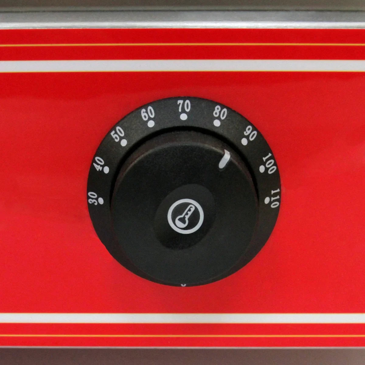 Black temperature dial on a bright red panel of the KuKoo Commercial Hot Dog Steamer, featuring clear markings for precise heat control