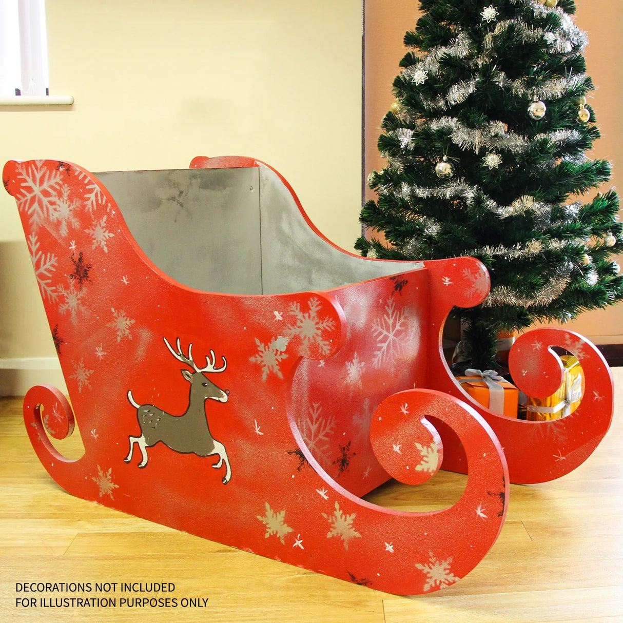 Vibrant red MDF Santa sleigh with snowflake patterns and a reindeer design, featuring curved edges and a smooth finish, perfect for holiday decor