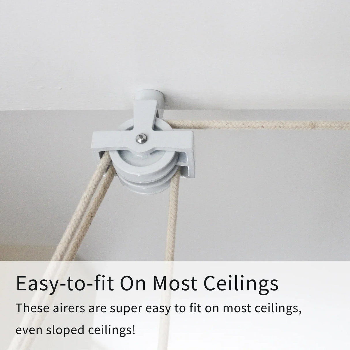 Ceiling-mounted clothing airer pulley in white, featuring a sturdy design with easy-to-fit installation for various ceiling types