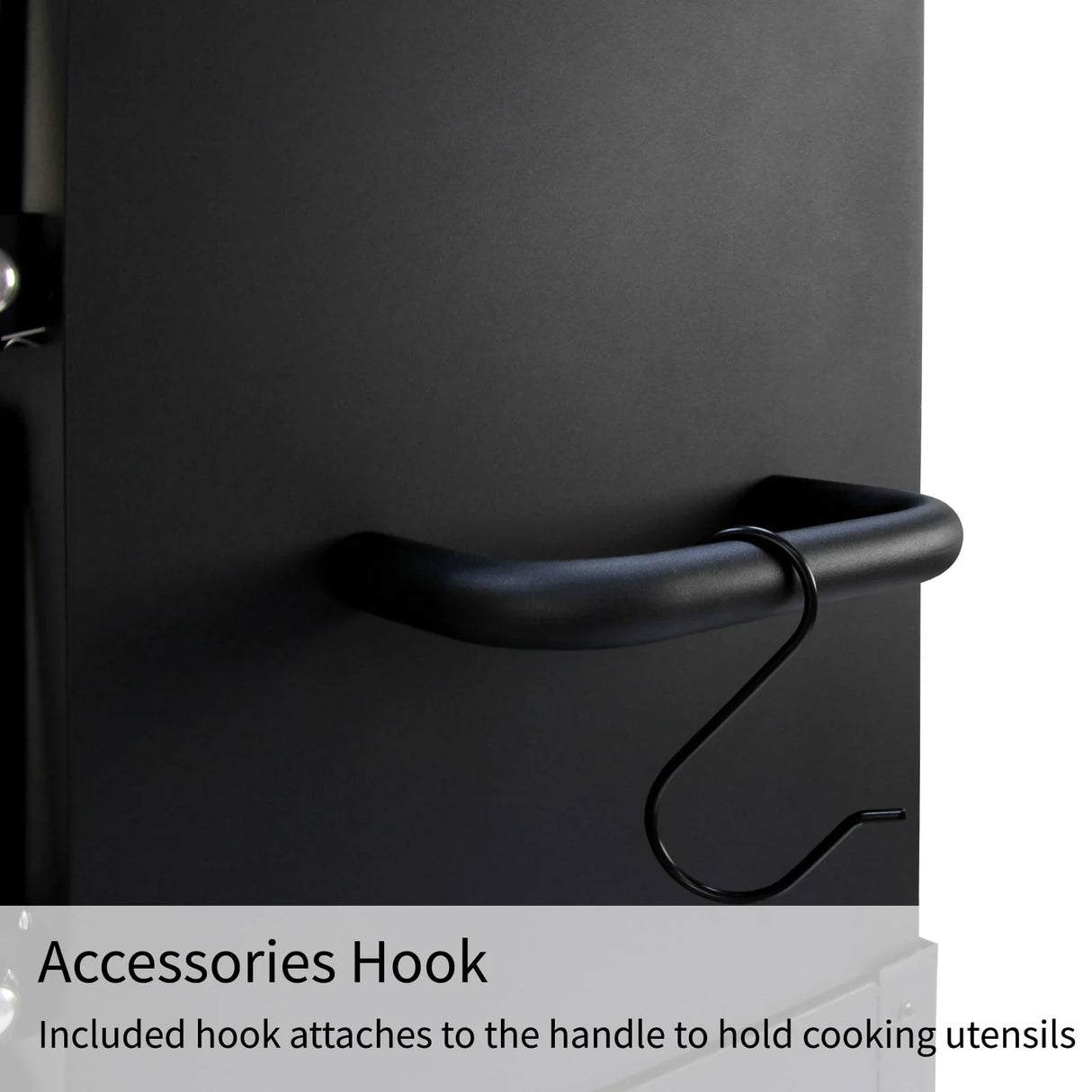 Black accessories hook attached to the handle of the KuKoo Outdoor Pizza Oven, designed for holding cooking utensils securely