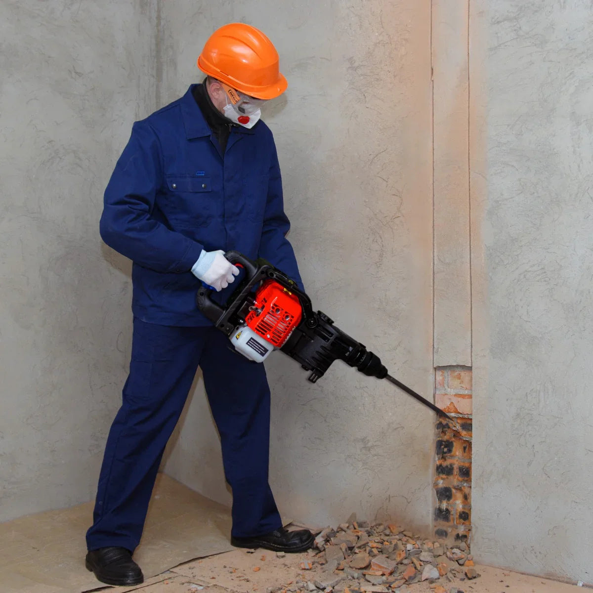 T-Mech 2-Stroke Petrol Hammer Drill in use, featuring a bright orange helmet, blue workwear, and a rugged design for heavy-duty drilling