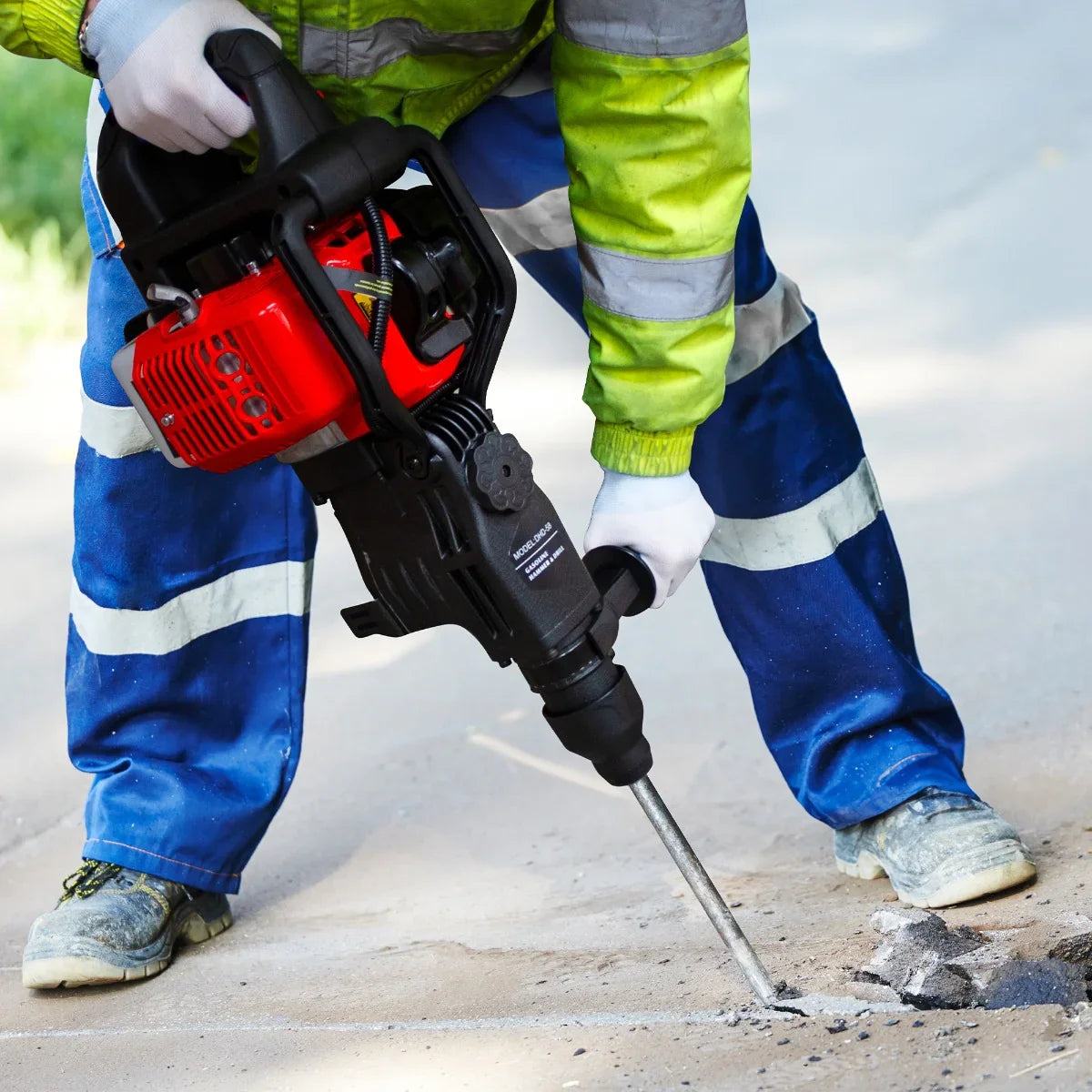 T-Mech 2-Stroke Petrol Hammer Drill in action, featuring a red and black design, powerful drill bit, and operator in safety gear