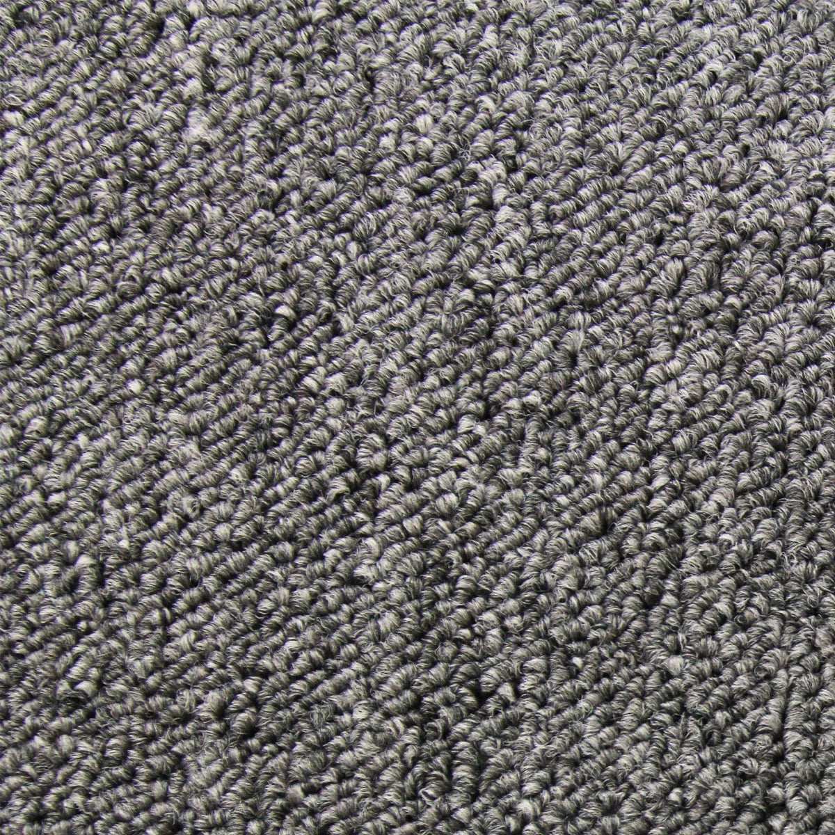 Anthracite carpet tiles with a textured, woven surface, showcasing a rich dark gray color ideal for modern interiors