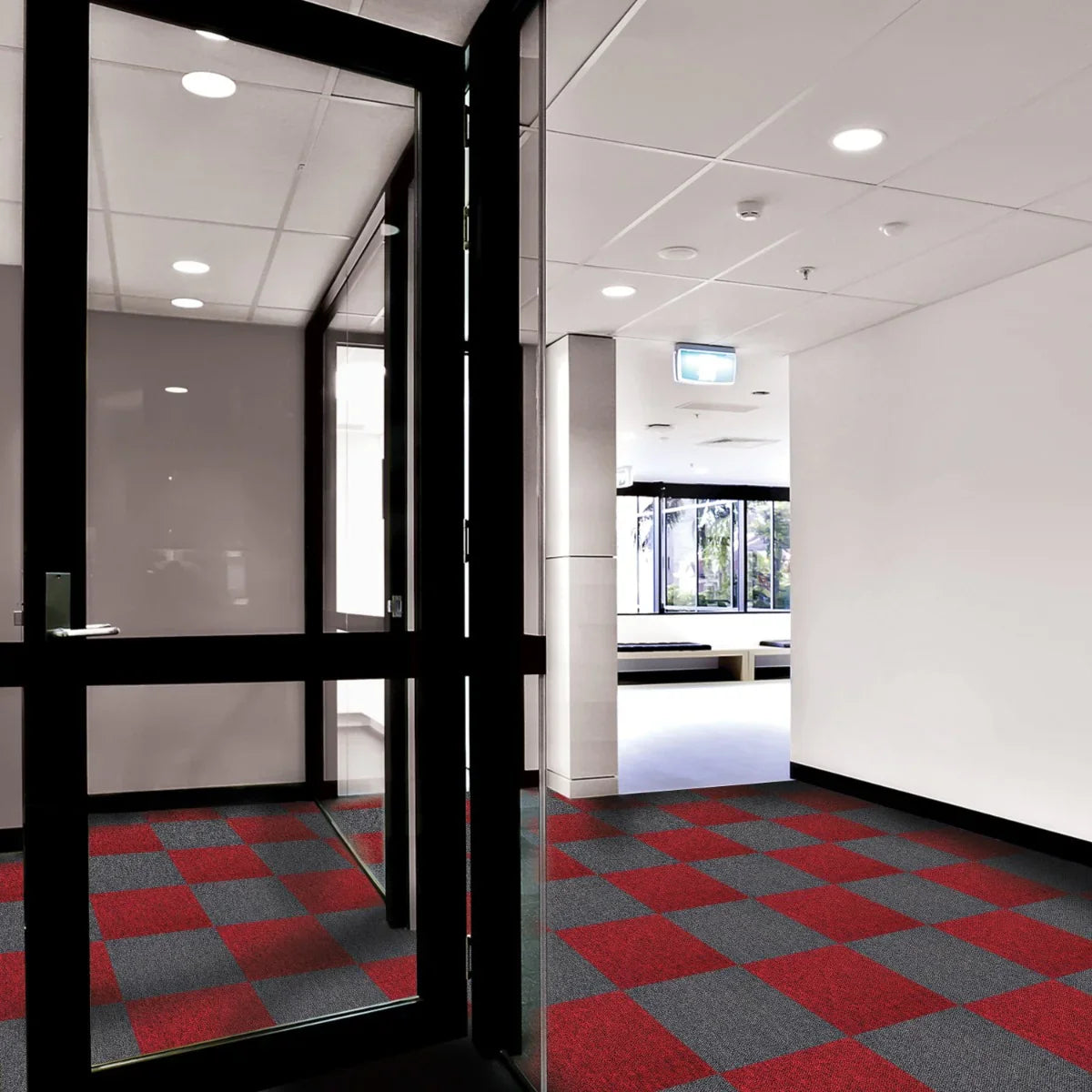 Charcoal black carpet tiles arranged in a modern hallway, featuring a sleek design and textured surface for durability and style