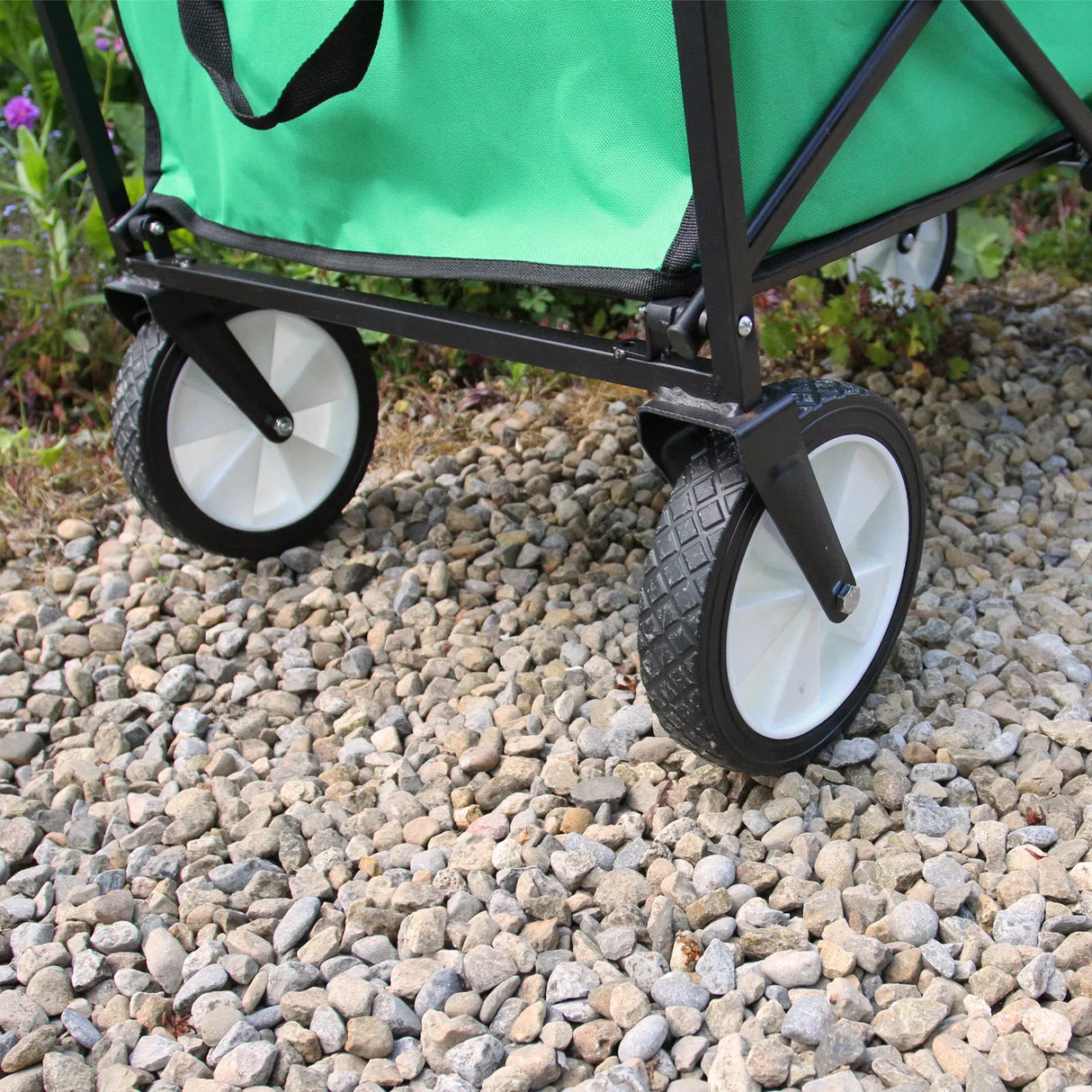 Foldable garden cart in vibrant green with sturdy black frame and durable wheels, perfect for transporting plants and gardening tools