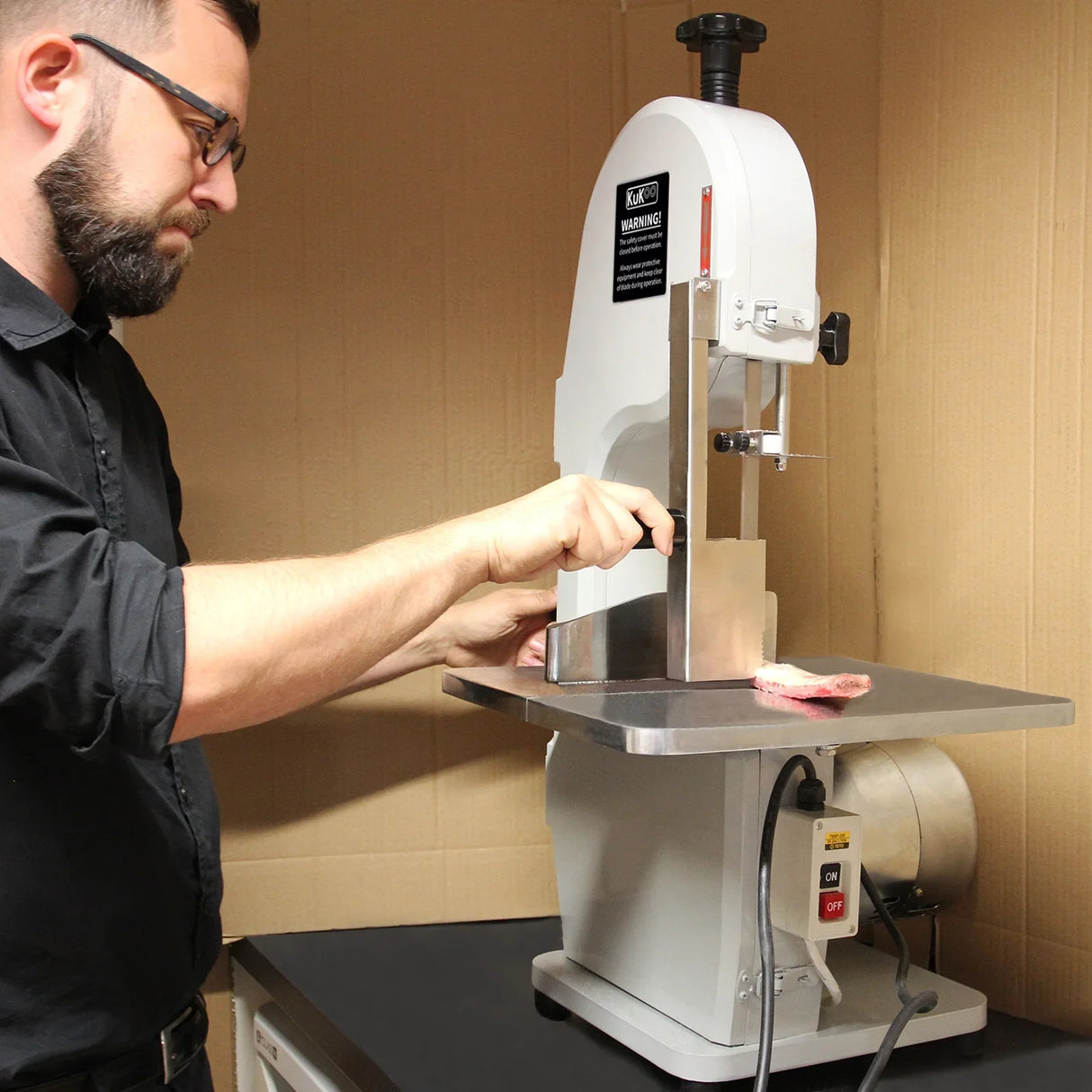 Kukoo Commercial Bone Saw Bandsaw with stainless steel blade, sturdy base, and adjustable cutting height, ideal for meat processing