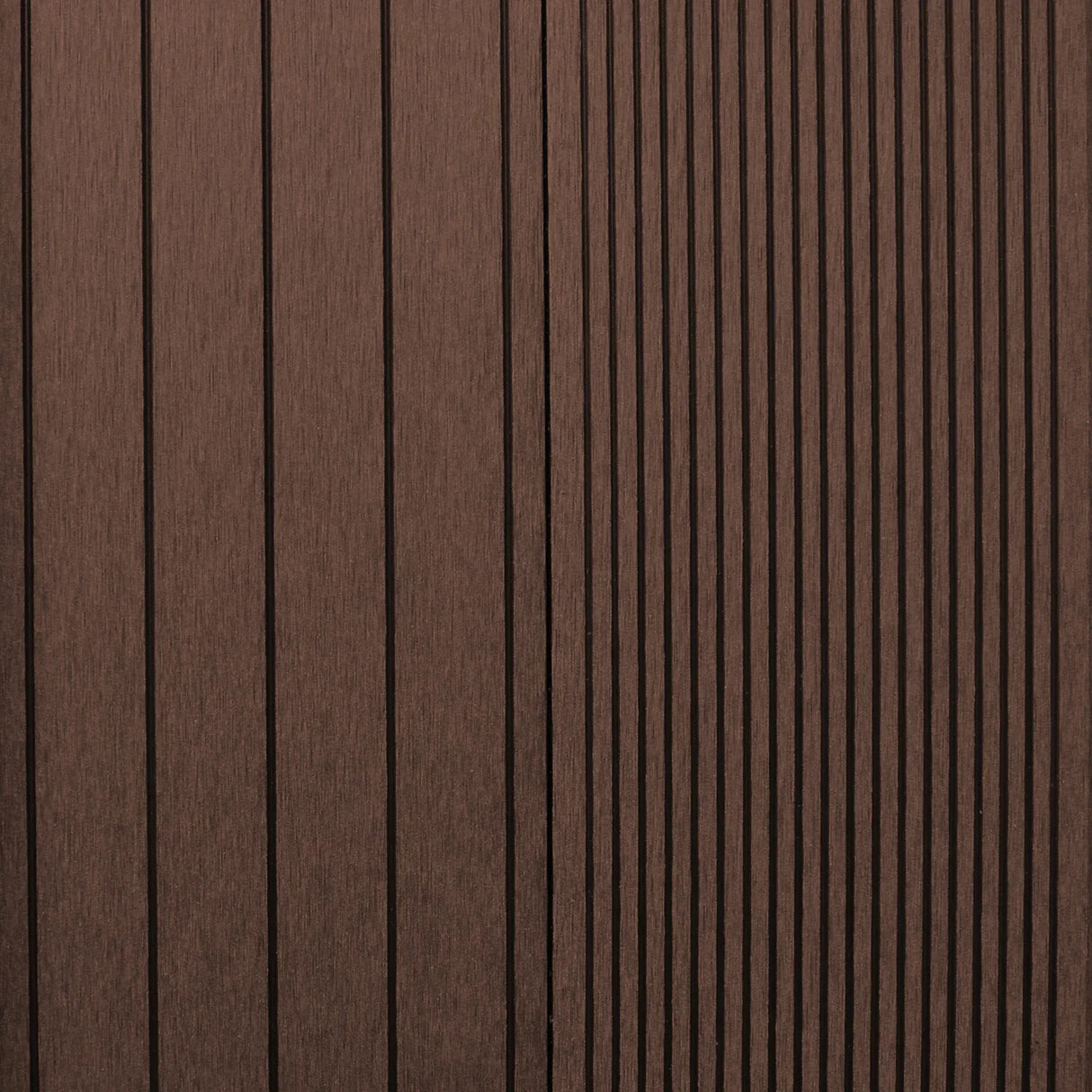 Jardí Composite Decking in Conker Brown, featuring a textured surface with vertical grooves, ideal for outdoor spaces and durability