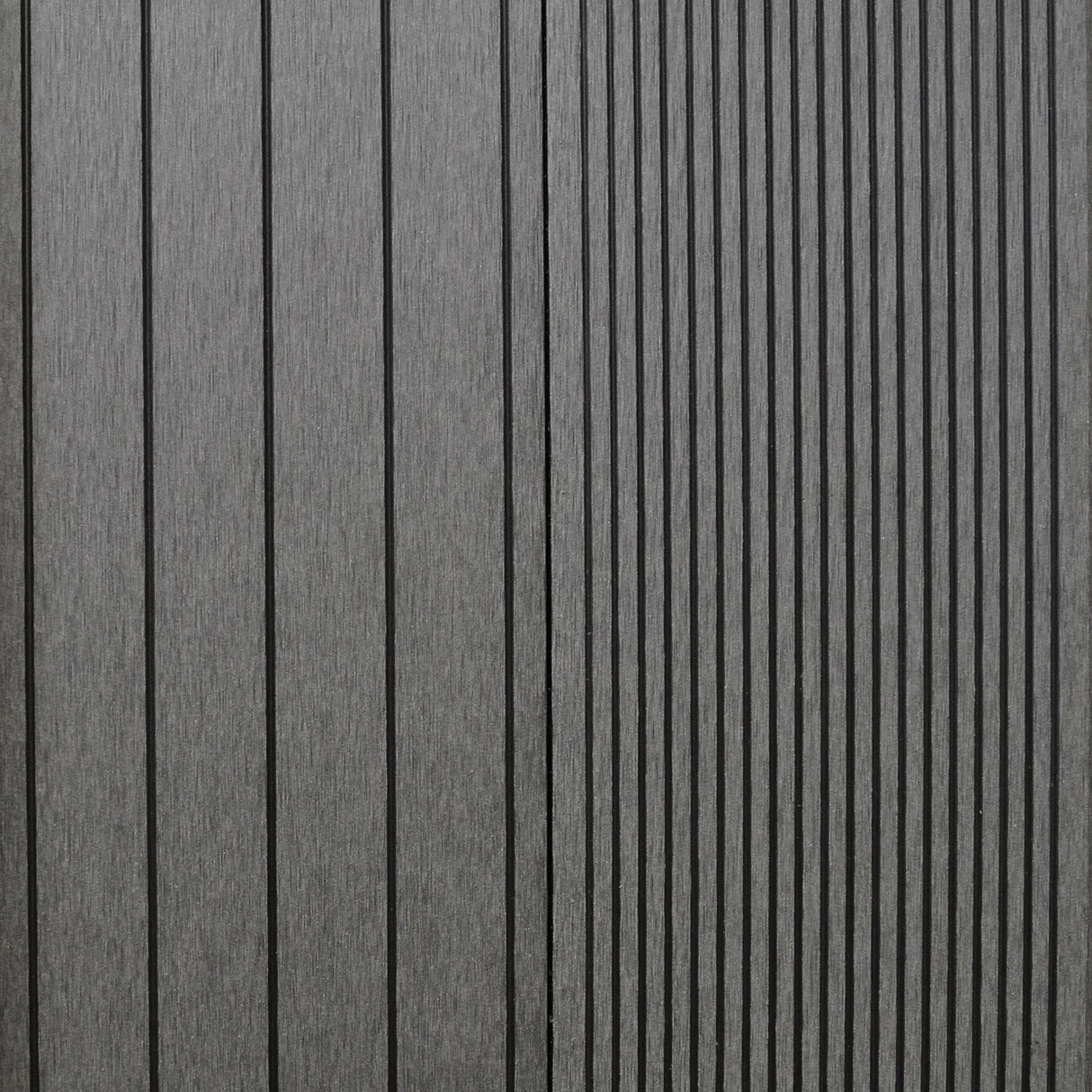 Castle Grey Jardí Composite Decking planks featuring a textured surface with vertical grooves, ideal for outdoor spaces and patios