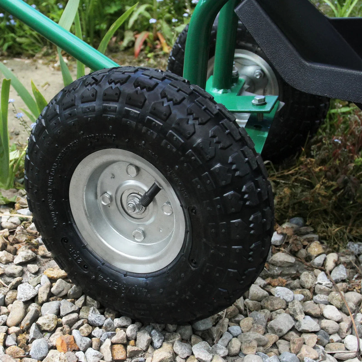 Heavy-duty mobile garden seat featuring robust black rubber tires, sturdy metal frame, and a textured seat for comfort and stability