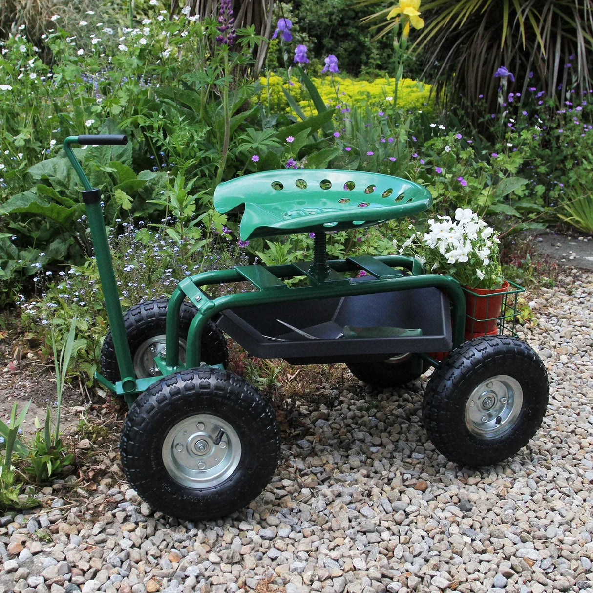 Heavy-duty mobile garden seat with a green plastic seat, sturdy frame, large wheels, and a planter basket, set in a flower garden