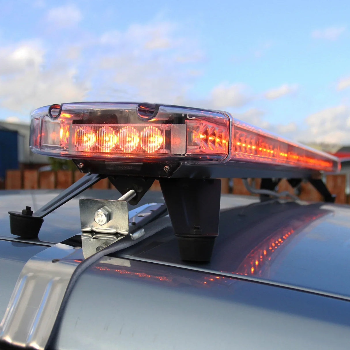 Amber Recovery Light 1200mm with bright orange LEDs, mounted on a vehicle roof, showcasing a sleek design and durable construction