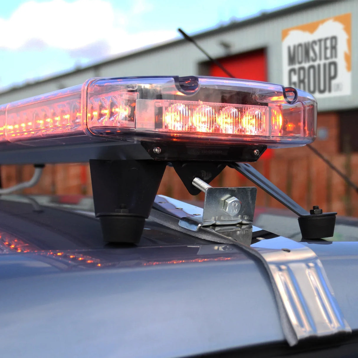 Amber Recovery Light 1200mm with bright orange LEDs, mounted on a vehicle, showcasing a sturdy base and clear protective cover
