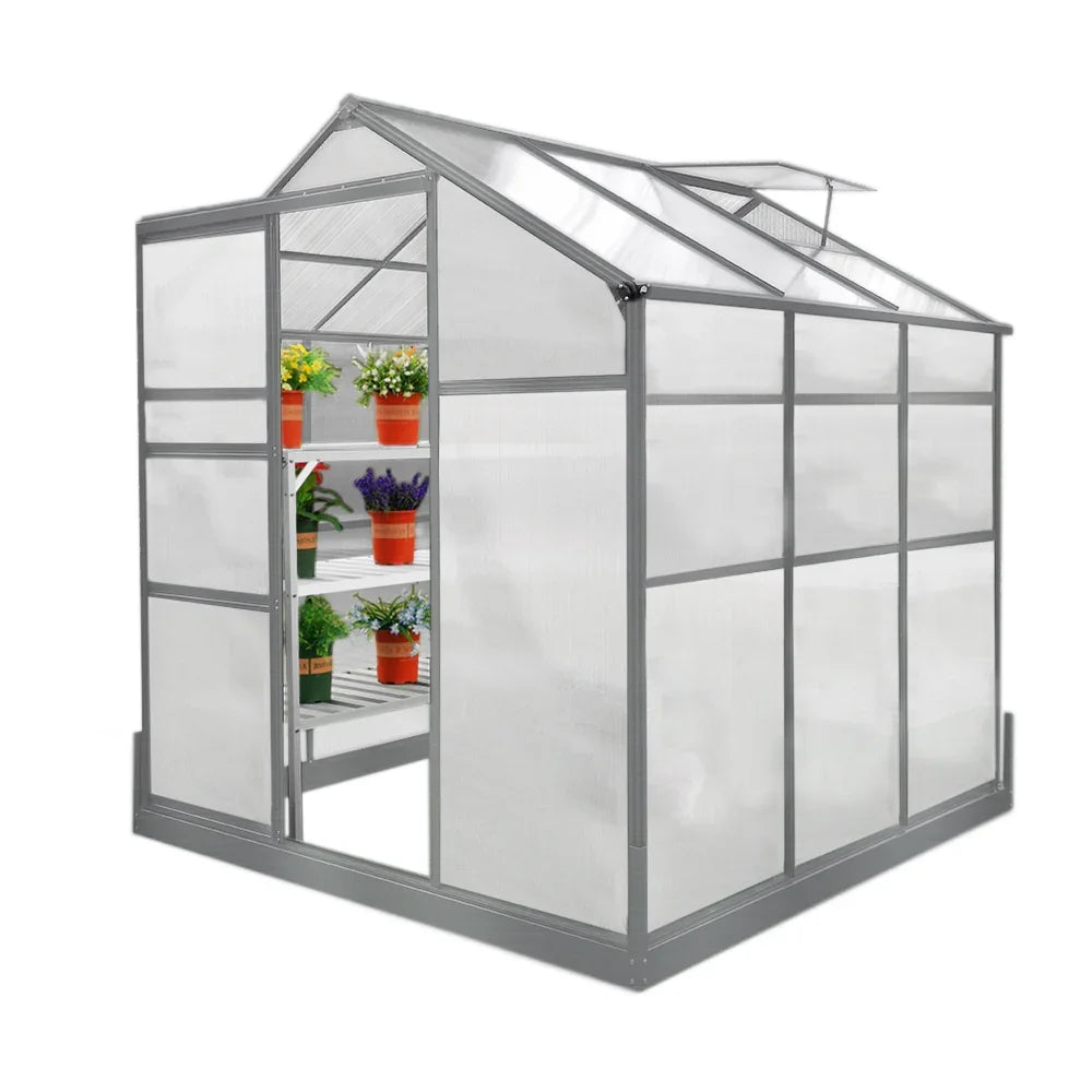 6ft x 6ft greenhouse with a sturdy base, featuring two water-resistant racks and clear panels showcasing vibrant potted plants inside