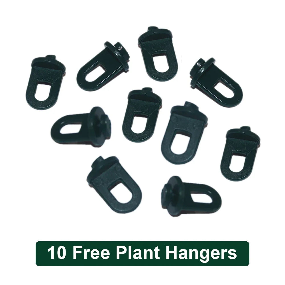 Ten black plastic plant hangers with a loop design, ideal for securing plants in a greenhouse or garden setup